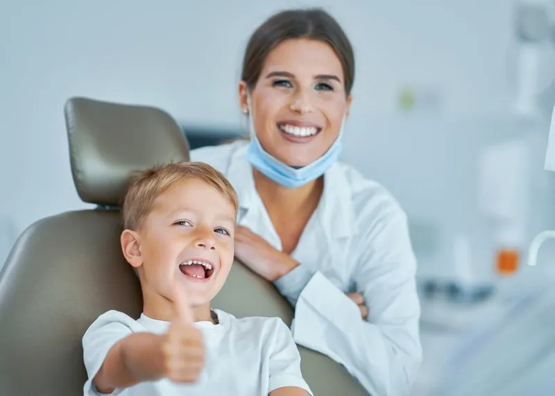 Dentist explaining an implant treatment plan to a patient in the consultation room