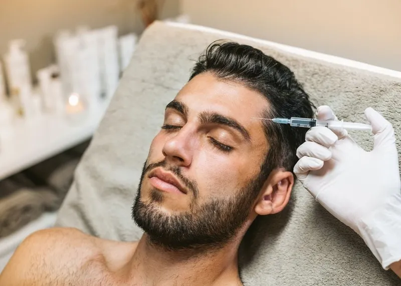 A patient consults with a cosmetic specialist about non-surgical treatment options at an Istanbul clinic.